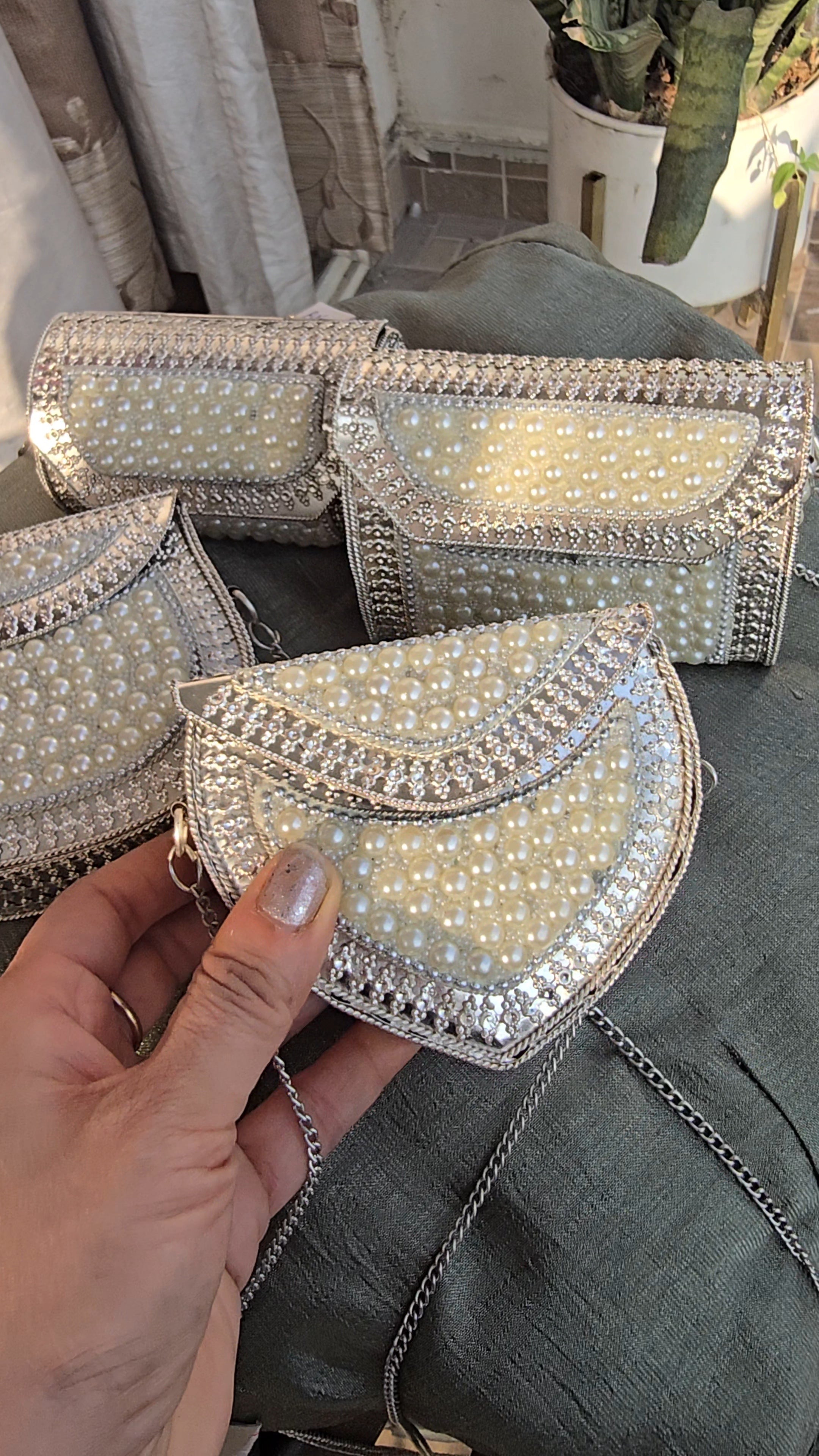 Exquisite Handcrafted PearlEmbellished Silver Metal Clutch with Detachable Chain